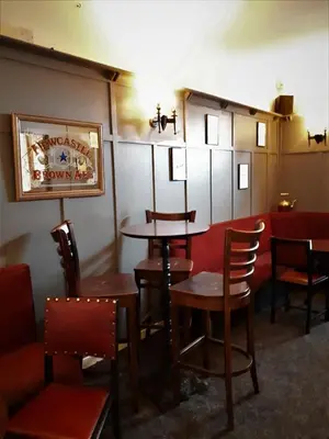 a dining room with tables and chairs in a restaurant at The Imperial Hotel in Castle Douglas