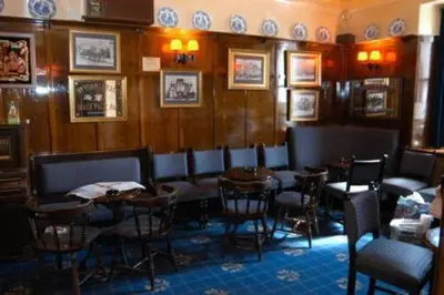 a dining room with tables and chairs in a restaurant at The Imperial Hotel in Castle Douglas