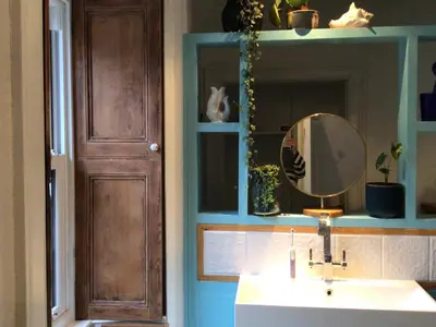 a bathroom with a sink and a mirror at Mansefield Rooms in Lockerbie