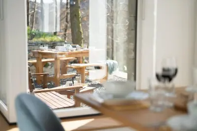 a table and chairs in a room with a window at Serene Retreat in Chapel Stile by LetMeStay in Ambleside