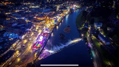 an aerial view of a city at night with a river at Southpark House in Dumfries