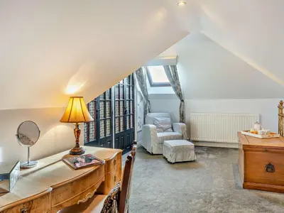 a living room with a desk and a chair at 4 Bed in Crosby-on-Eden 94398 in Crosby