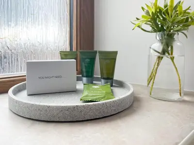 a table with three vases and a laptop on it at Pippa's Cottage - Uk42332 in Little Blencow