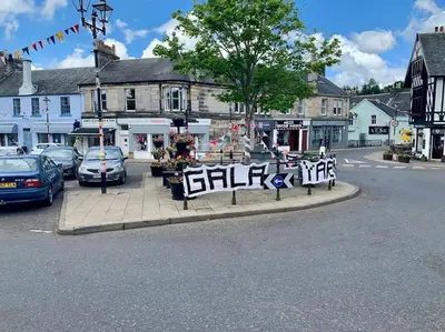 a street with cars parked on the side of the road at WestLaigh Lrg Luxury Country Farm House 20 min from the city in Glassford