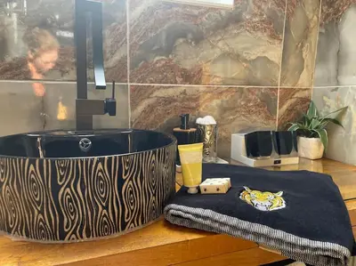 a bath tub sitting on top of a wooden counter at WestLaigh Lrg Luxury Country Farm House 20 min from the city in Glassford