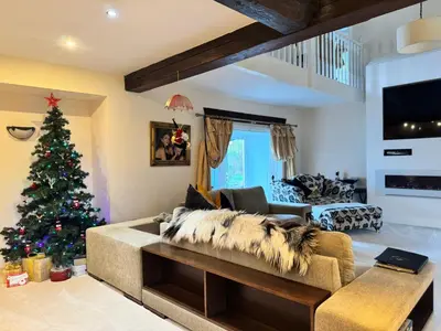 a living room with a christmas tree and a couch at WestLaigh Lrg Luxury Country Farm House 20 min from the city in Glassford