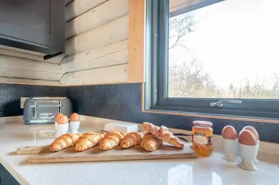 a group of croissants and eggs on a kitchen counter at 3 Bed in Colvend oc-t28900 in Kippford