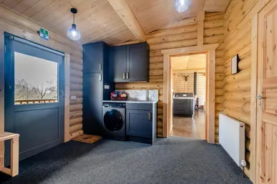 a kitchen with a washer and dryer in a cabin at 3 Bed in Colvend oc-t28900 in Kippford