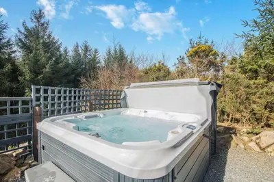 a large hot tub sitting on a patio at 3 Bed in Colvend oc-t28900 in Kippford