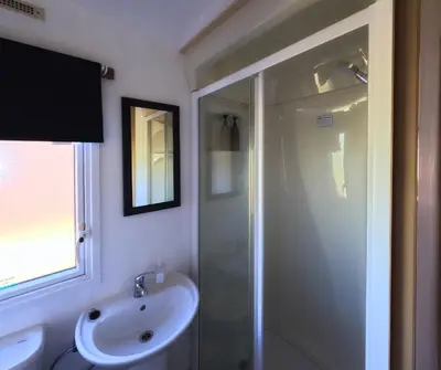 a bathroom with a shower and a sink at Woodside, Meadows Retreat, Cockermouth in Plumbland