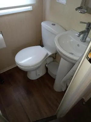 a bathroom with a toilet and a sink at Green Dream in Cockermouth