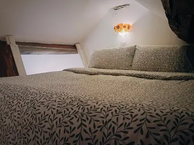 a bedroom with a bed and a window at The Duddon Nest in Ulpha