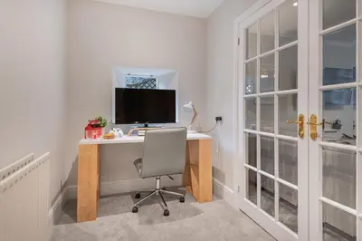 a home office with a desk with a computer on it at Rockwood- Grasmere family cottage with Hot tub in Grasmere