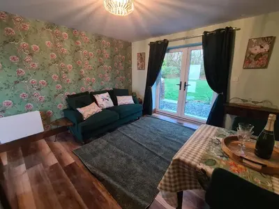 a living room with a couch and a window at The Nest by Blake view holidays, a peaceful boutique retreat, 3 miles from Ennerdale- small twin or king bed available in Rowrah