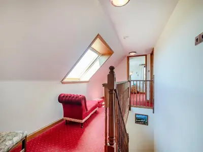 a living room with a red couch and a window at Barnstable - Uk46888 in Kilmory