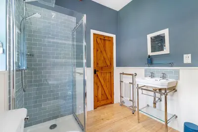 a bathroom with a sink and a shower at The Mews in Keswick