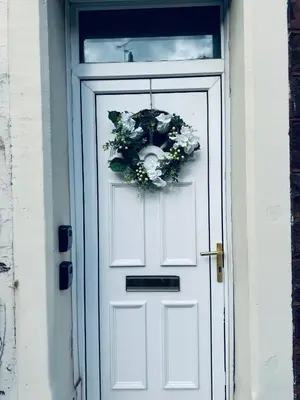 a white door with a wreath on it at Cumberland House-2 Bedrooms - Sleeps 4 in Workington