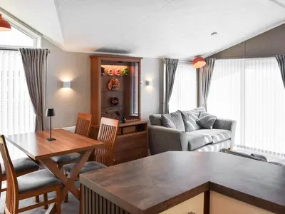 a living room with a couch and a table at Solway Escape in Plumbland