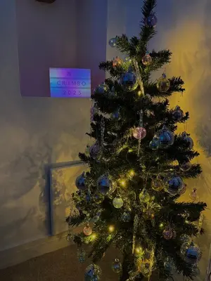 a christmas tree with a clock on top of it at Quirky & Comfortable Residence in Workington