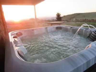a hot tubificialificialificialificialificialificialificialificialificialificialificialificialificial at Cot Cottage - Panoramic Views & Hot Tub! in Castle Douglas
