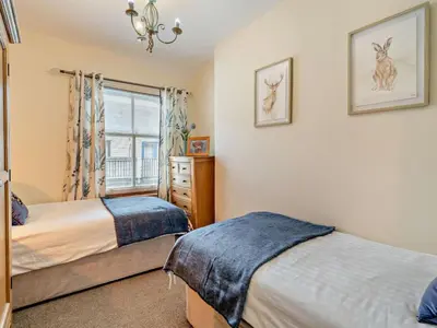 a bedroom with two beds and a window at 2 Bed in Keswick oc-94995 in Keswick