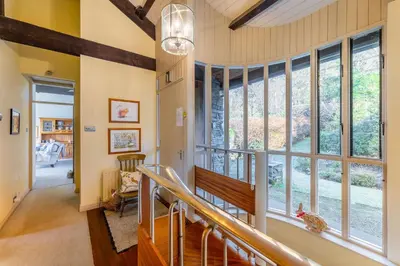a hallway with a large window in a house at Grey Crag Barn in Grasmere