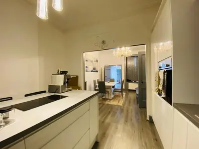 a kitchen with a counter top and a living room at Golfers lovers! Near all famous golf courses in Prestwick