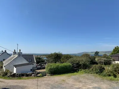 a view of a house from the road at Birds Nest in Gatehouse of Fleet