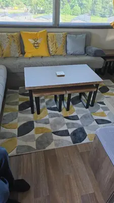 a coffee table in a living room with a couch at Luxury static caravan in Beattock