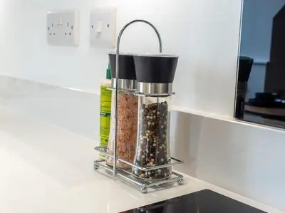a container of seeds sitting on a counter at The Penthouse - Crosby St 2 Bed in Maryport