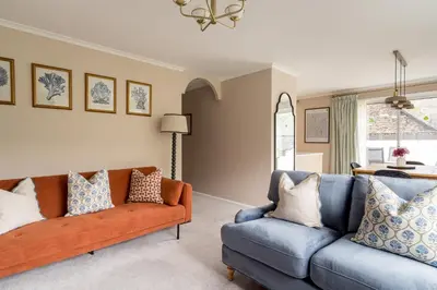 a living room with a couch and a chair at Oakbank-Central Grasmere in Grasmere