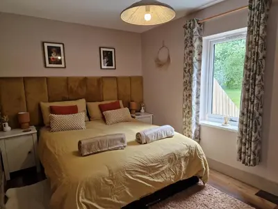 a bedroom with a bed with two pillows on it at The Drey by Blake view holidays, a peaceful boutique retreat, 3 miles from Ennerdale- small twin or king bed available in Arlecdon
