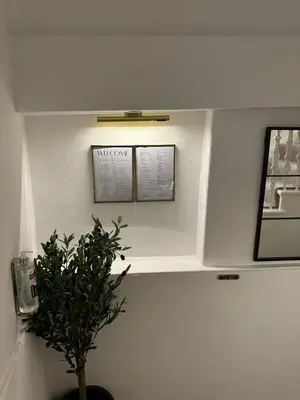 a room with a potted plant and a shelf at Luxury High Street Apartment in Moffat