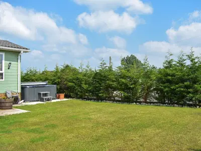 a yard with a green house and some trees at Meadows Lodge - Uk46825 in Plumbland