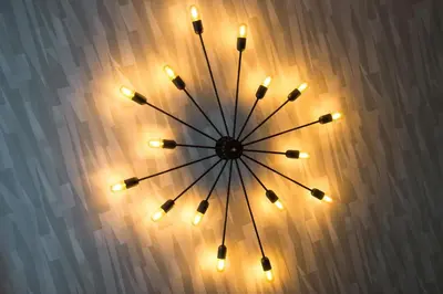 a lit up clock with lights on a wall at Inn on the Square in Keswick