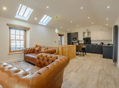 a living room with a couch and a kitchen at 2 Bed in Dalston 93820 in Dalston