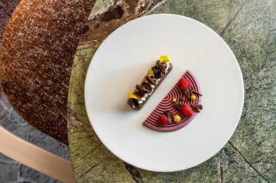 a plate with a dessert on a table at Lodore Falls Hotel & Spa in Keswick