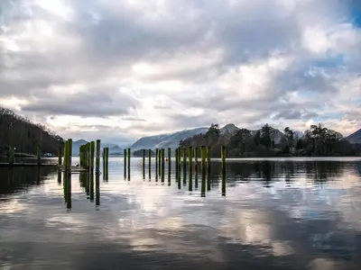 a body of water with poles in the water at Catbank in Bridekirk