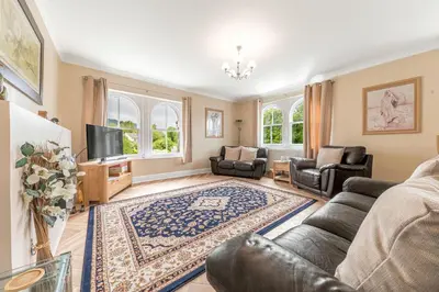 a living room with a couch and a tv at Stickle Tarn in Keswick