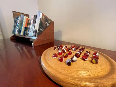 a wooden plate with fruit in the shape of a face at Charming Cosy Traditional Scottish Cottage - Pass the Keys in Castle Douglas