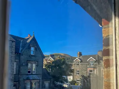 a view from a window of an old house at Anley Cottage with garden and private parking in Keswick in Keswick
