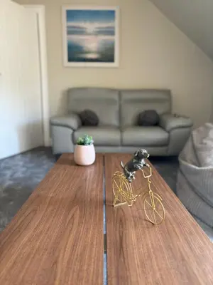 a toy bike on a coffee table in a living room at Golfers Rest in Ayr