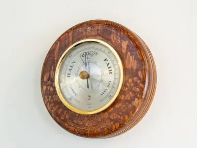 a wooden clock on a white background at Newly Renovated 2 Bed Property - Pass the Keys in Cleator Moor