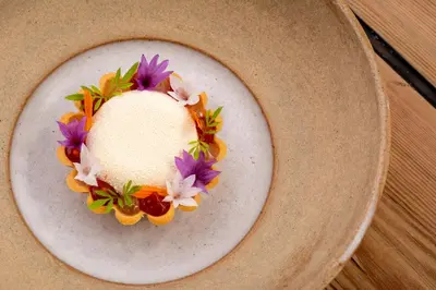 a plate with a wreath of flowers on it at Forest Side Hotel in Grasmere