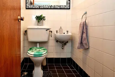 a bathroom with a toilet and a sink at Finest Retreats - Unerigg in Grasmere