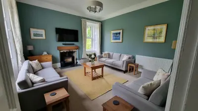 a living room with two couches and a television at Lady Farm - Bargany in Girvan