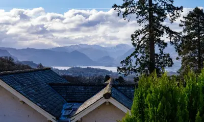 a roof of a house with mountains in the background at Underscar - Manesty in Keswick