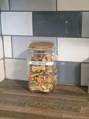 a glass jar filled with nuts and sprinkles on a table at The Old Bank at St Bees, Western Lakes in St Bees