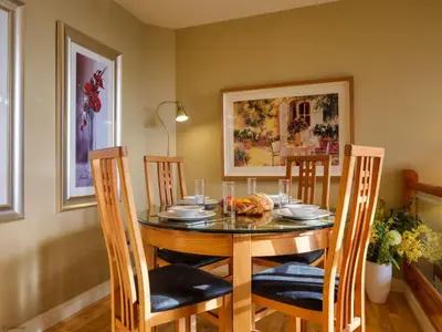 a dining room with a table and four chairs at Underscar - Grange in Keswick