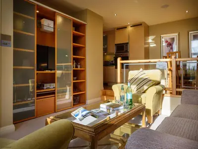 a living room with a couch and a coffee table at Underscar - Grange in Keswick